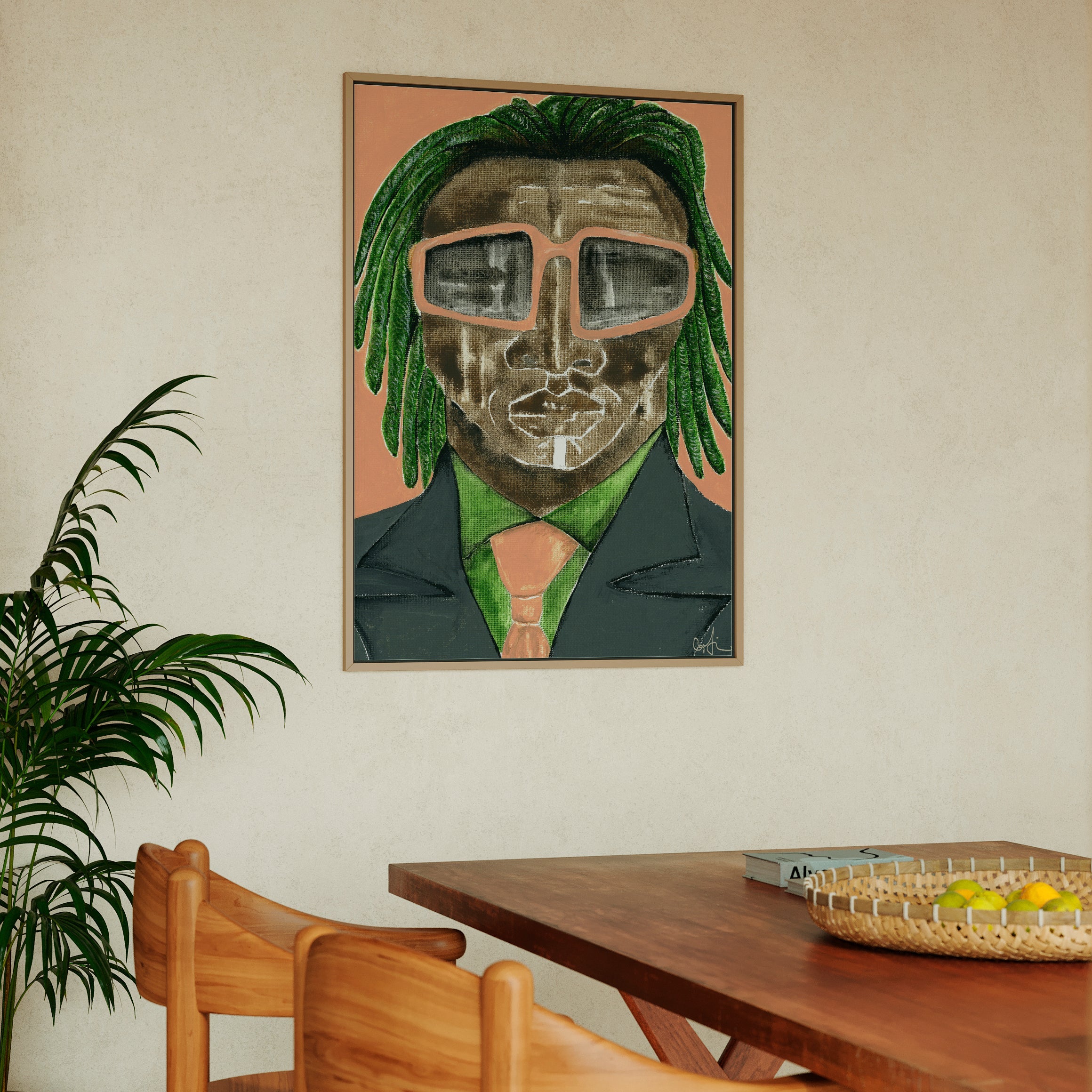 Dining room with a framed artwork of a person with green hair and glasses on the wall.