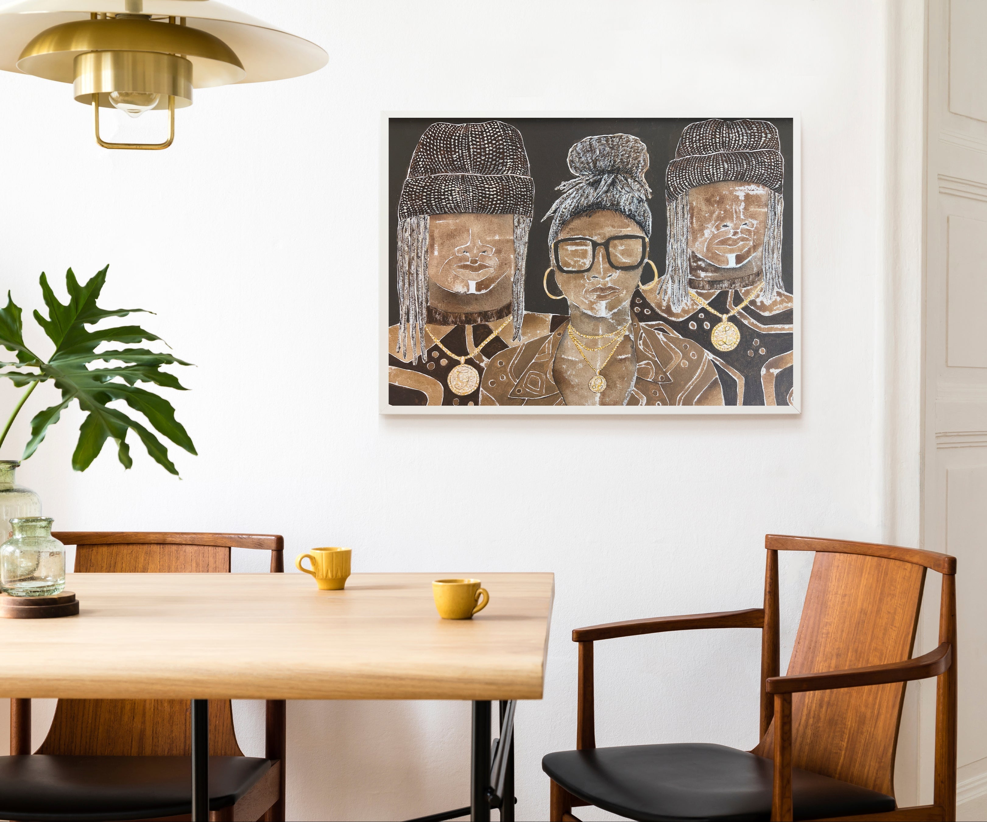 Dining room with wooden table, chairs, and a wall art piece.